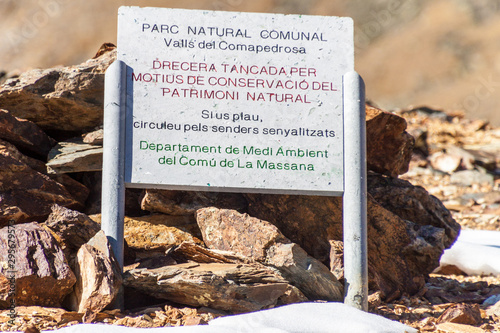 Information board in Parc Natural Comunal de les Valls del Comapedrosa national park in Andorra It says: walk on the marked trails. photo