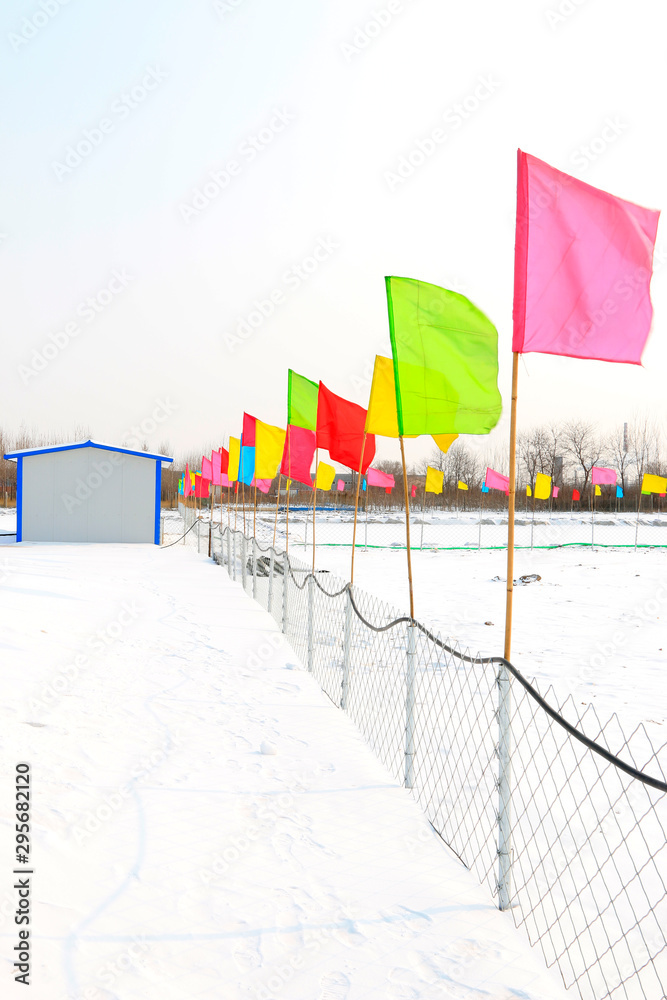 Fototapeta premium Colorful flags in the snow