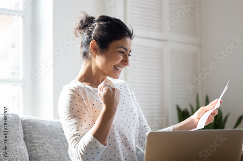 Fotografija Happy Indian woman reading good news in letter, notification