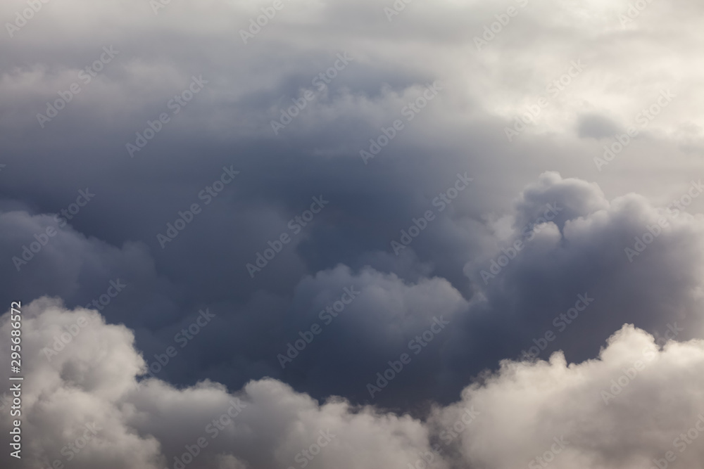 Dark puffy cloud layers and sky background Dark puffy cloud layers and sky background