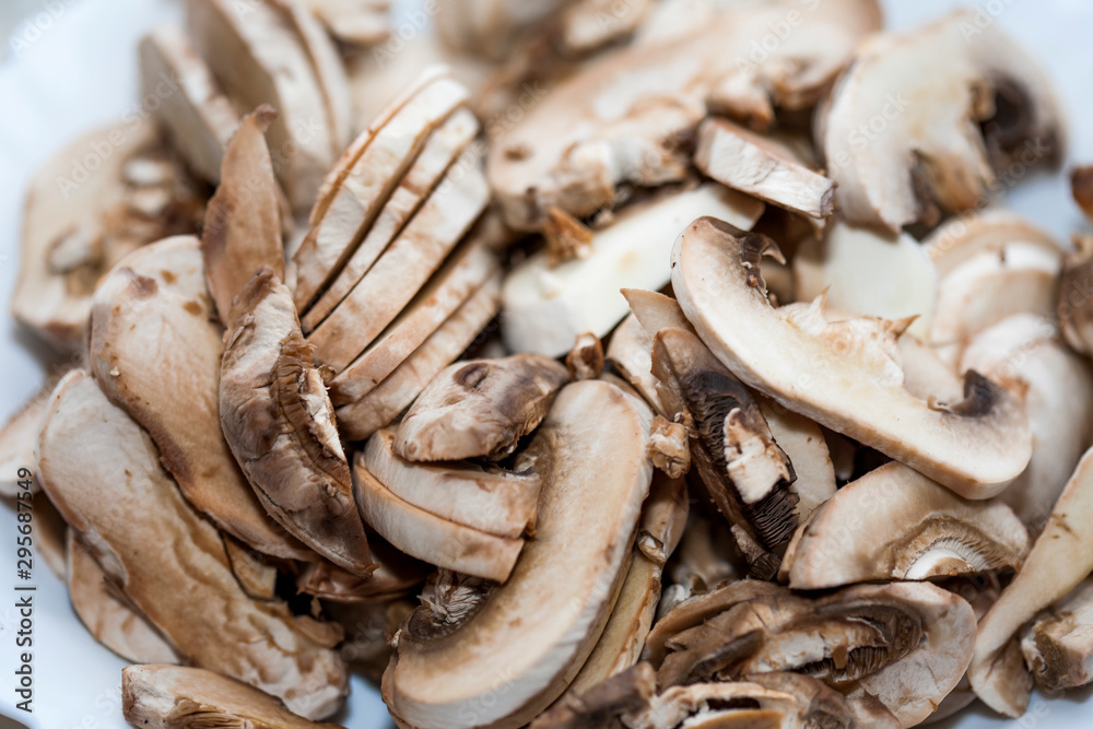 chopped mushrooms on a chopping board chopped mushrooms on a chopping board