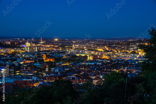 Germany, Night lights of illuminated skyline and cityscape of downtown stuttgart city, aerial view from above by night