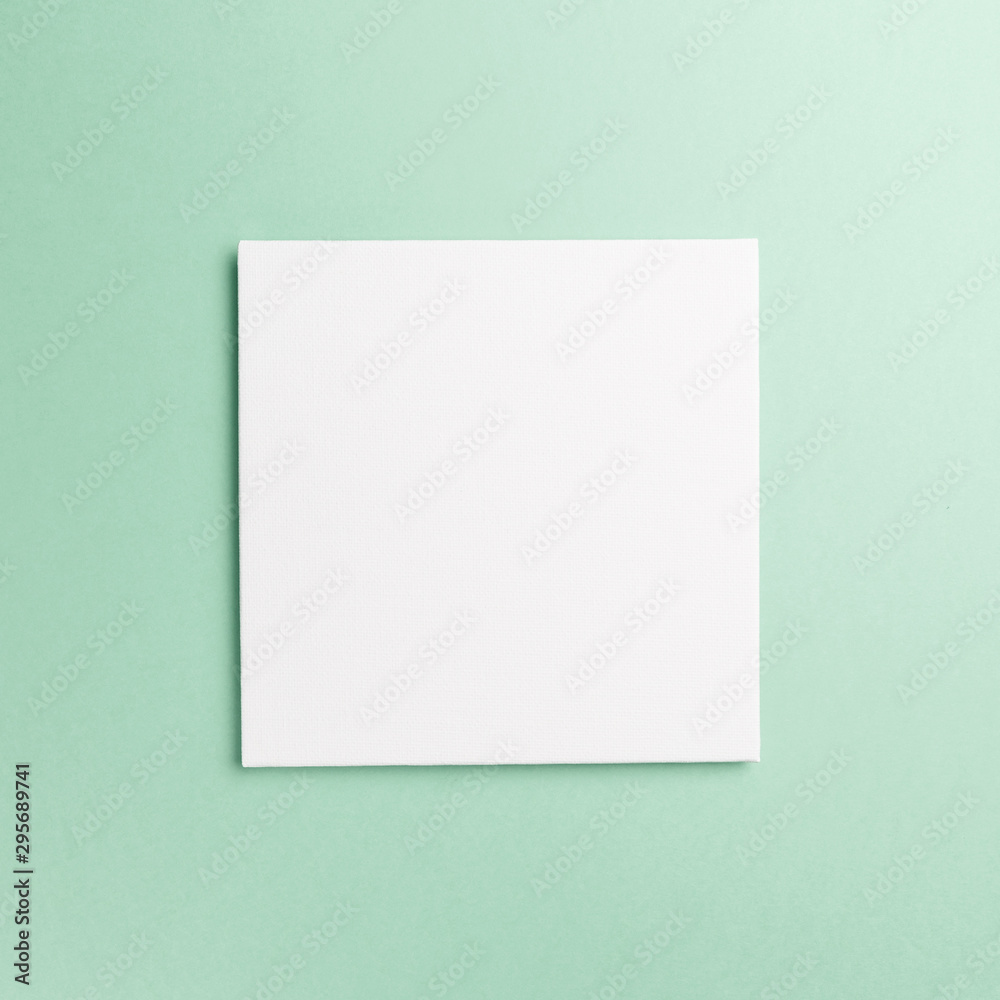 Creative layout made of paper blank on pastel on mint background. Top view. Flat lay. Copy space. Colorful background. Minimal creative concept. Neo mint - trendy color of the year 2020 Creative layout made of paper blank on pastel on mint background. Top view. Flat lay. Copy space. Colorful background. Minimal creative concept. Neo mint - trendy color of the year 2020