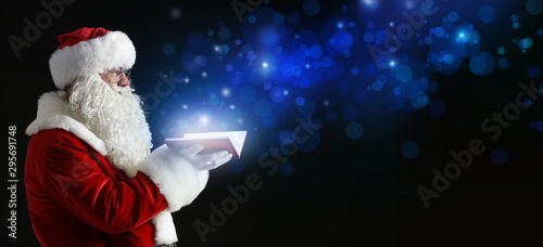Santa Claus with magic book...