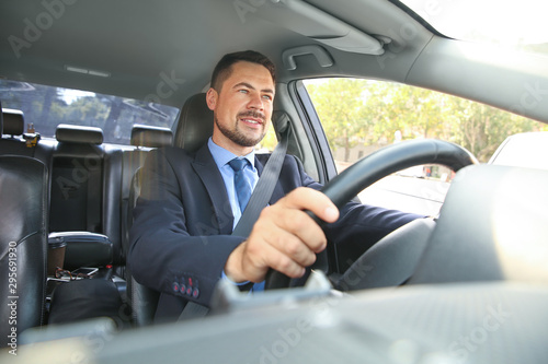 Successful businessman driving modern car
