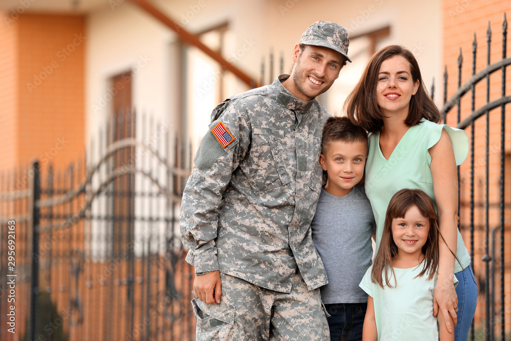 Fototapeta premium Happy military man with his family outdoors