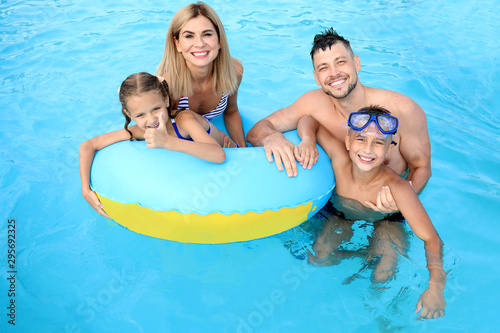 Happy family resting in aqu...