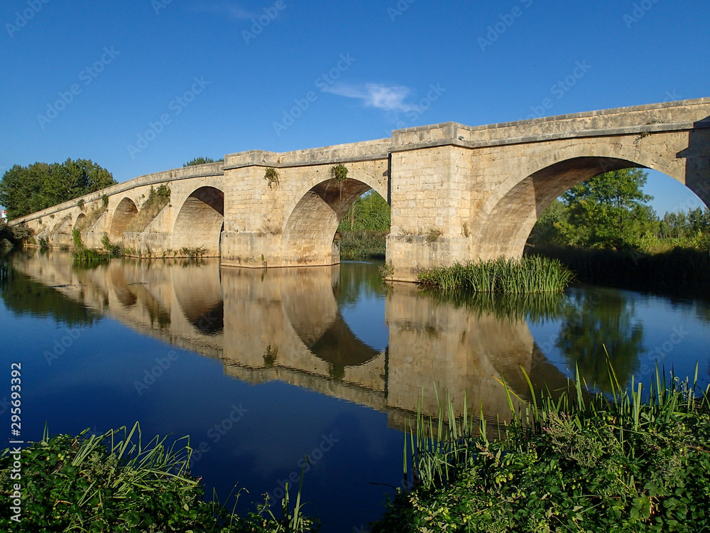 Reflection of Medieval Bridge over Pisuerga River near Itero del Castillo Spain
