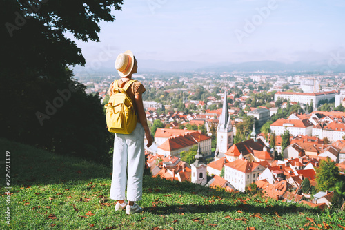 Young girl with backpack explores Ljubljana. Travel Slovenia