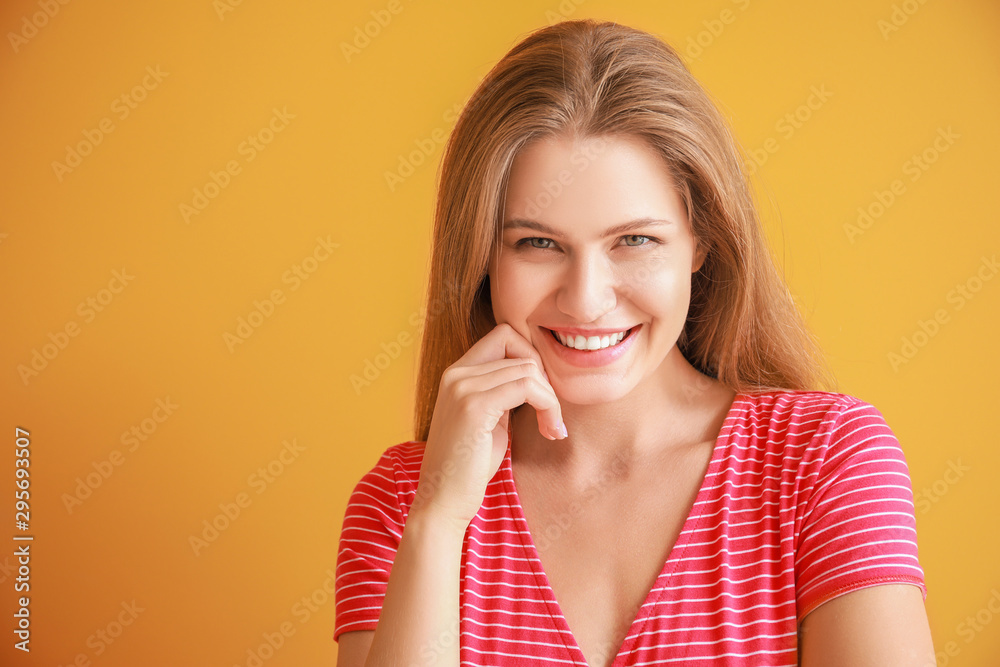 Fototapeta premium Portrait of beautiful woman on color background