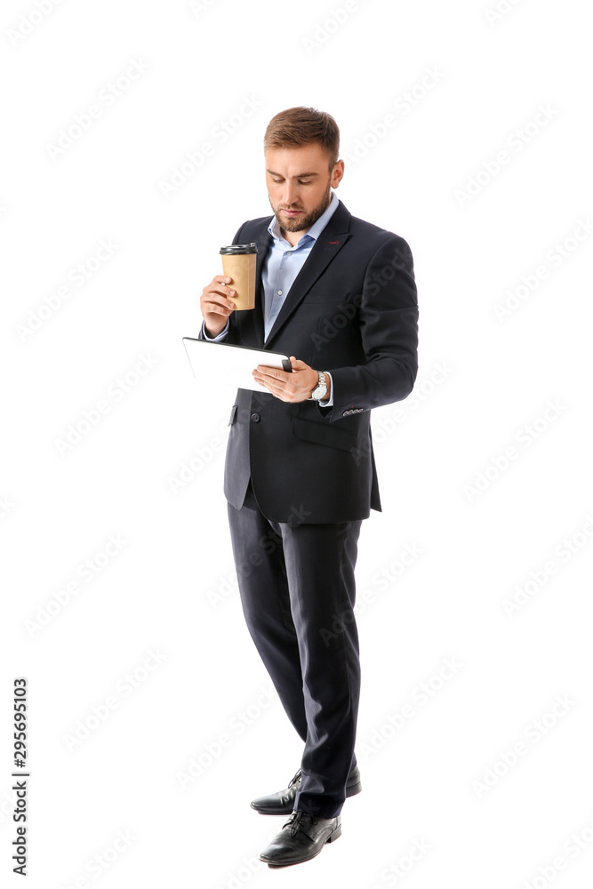 Portrait of handsome businessman with coffee and tablet computer on white background