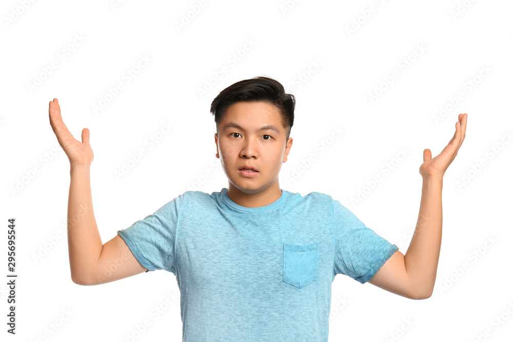 Portrait of confused Asian man on white background Portrait of confused Asian man on white background
