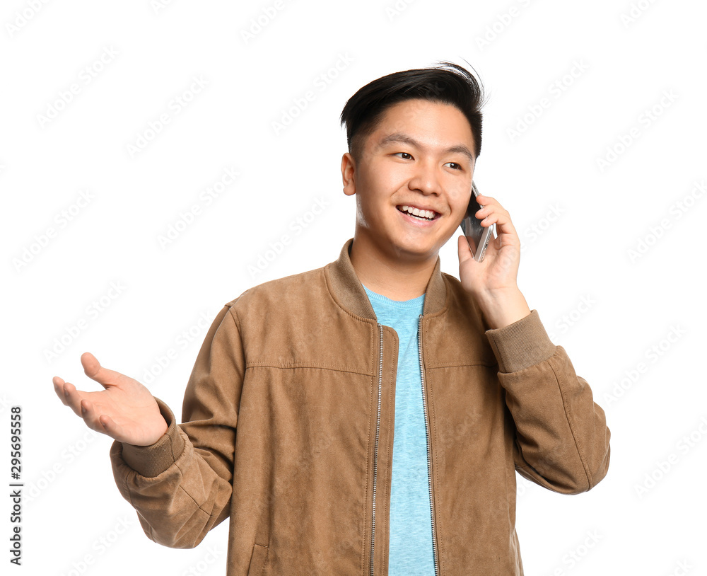 Portrait of Asian man talking by mobile phone on white background Portrait of Asian man talking by mobile phone on white background