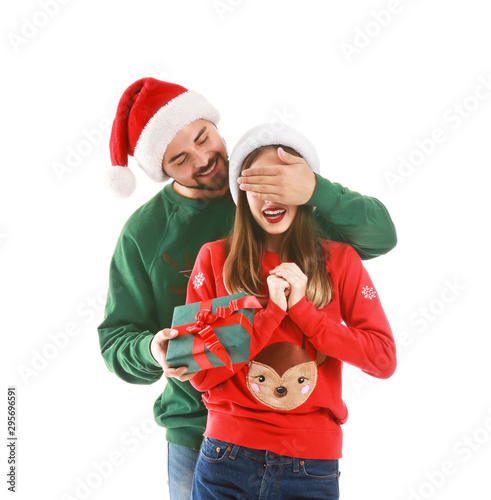 Man giving Christmas presen...