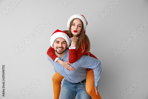 Happy young couple in Santa...