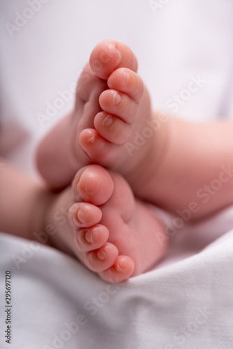 Newborn baby feet on a white blanket. Baby feet.