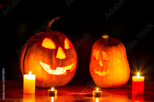 halloween night scene, pair of jack o lantern pumpkin with candle on the table