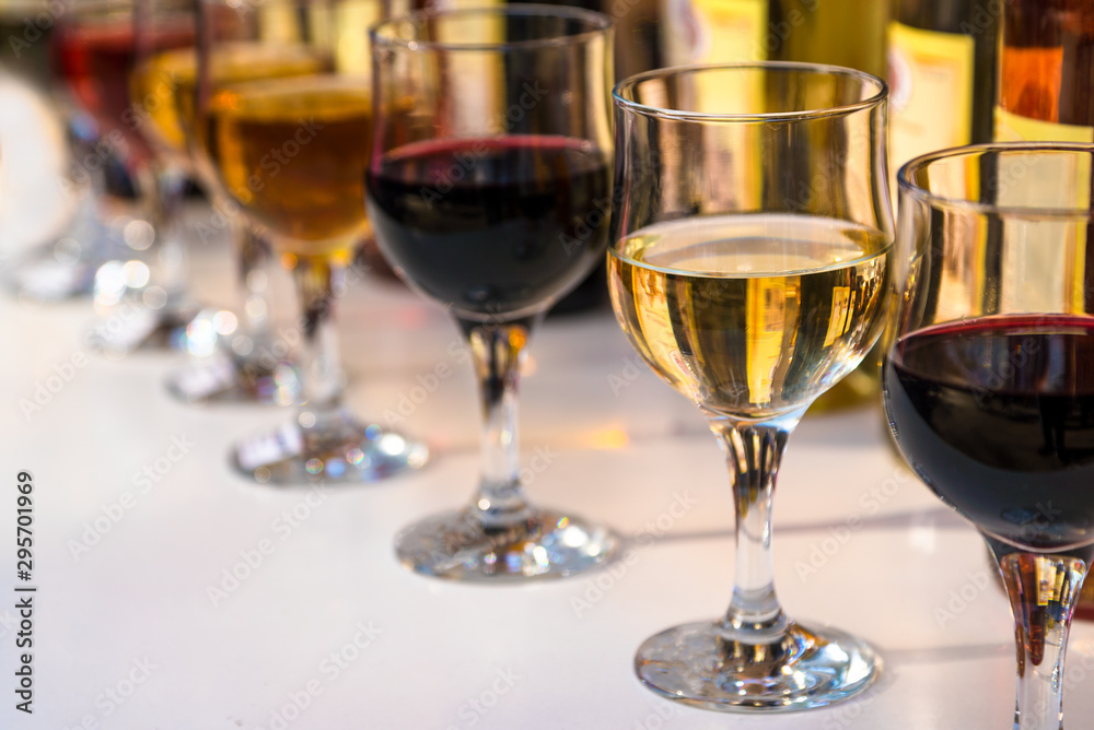 wine in glasses at the tasting. wine in glasses at the tasting.