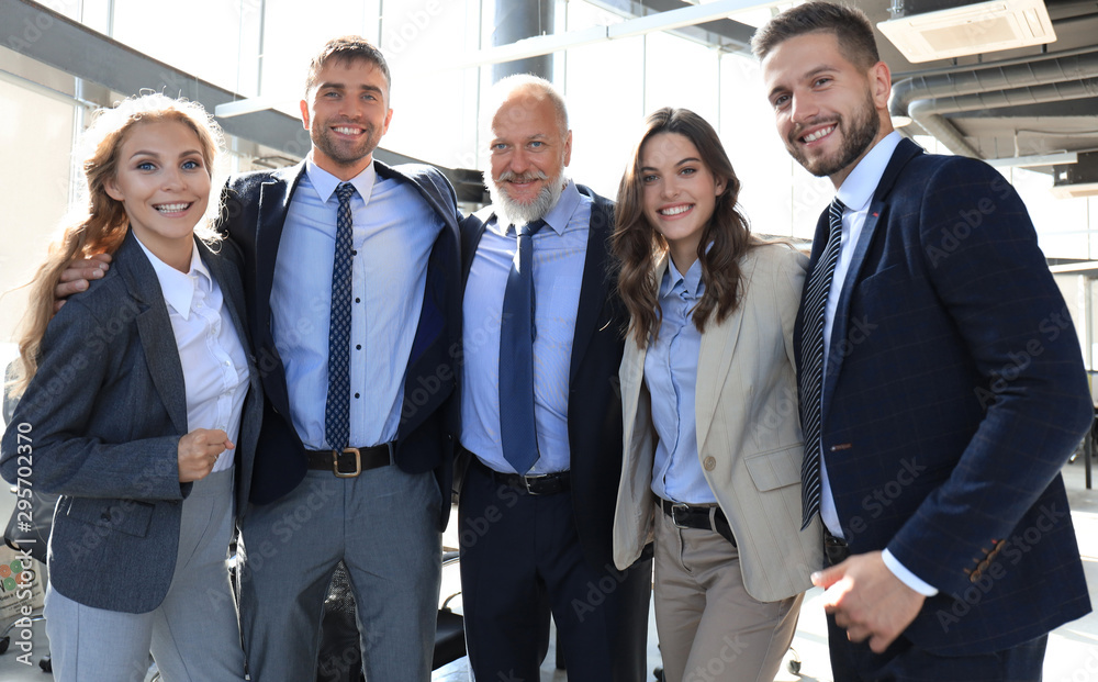 Group portrait of a professional business team looking confidently at camera. Group portrait of a professional business team looking confidently at camera.