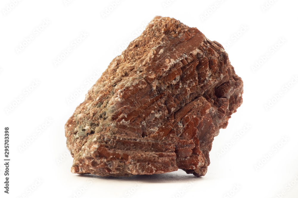 Rock of red gypsum mineral from Spain isolated on pure white background. Rock of red gypsum mineral from Spain isolated on pure white background.