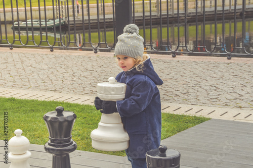 family baby dad mom Playground play autumn outside chess