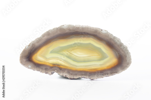 Polished slice of agate mineral from Brasil with multiple colors isolated on a pure white background.