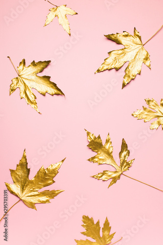 Autumn flat lay with golden leaves creative pattern