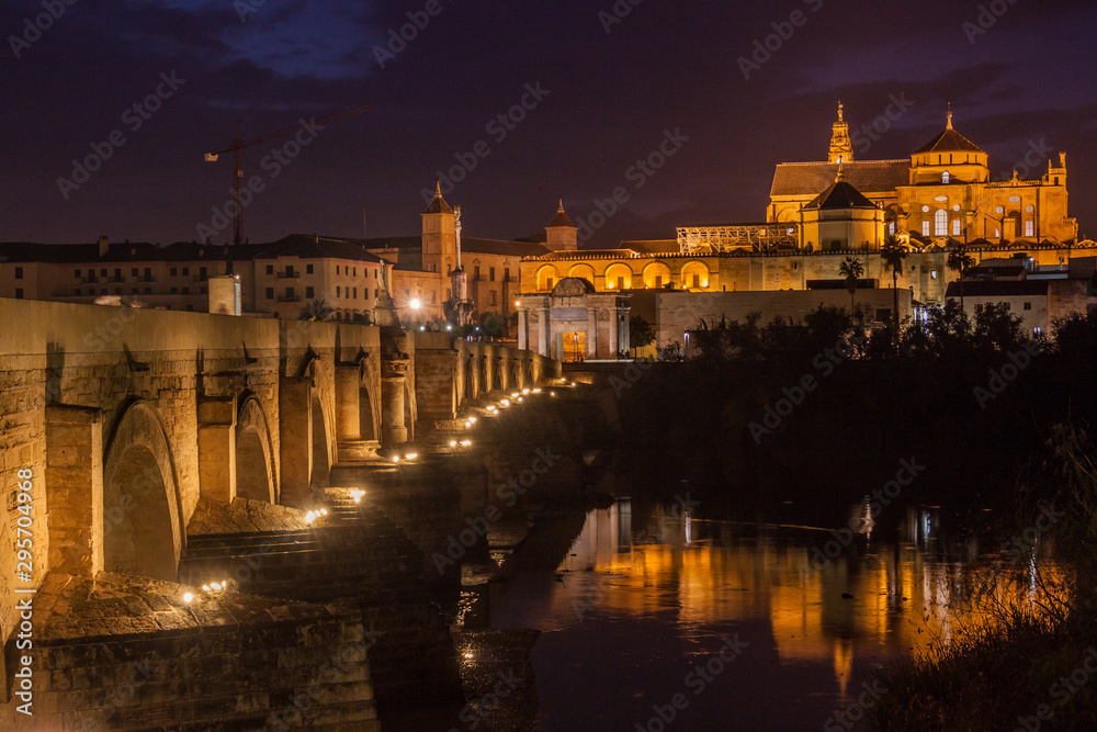 Evening view of the Mosque-Cathedral and Roman Bridge in Cordoba, Spain