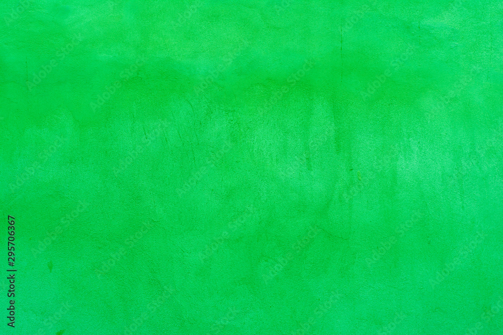 Background of an old concrete wall painted green with fine texture