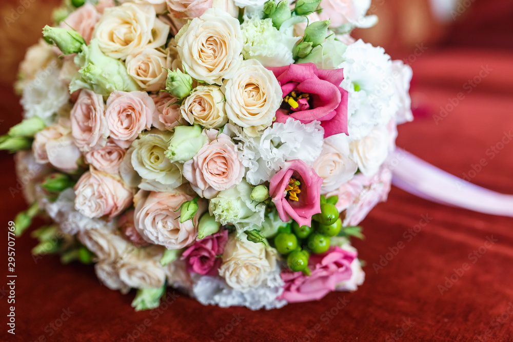 bright wedding bouquet of summer white pink roses  with wedding rings