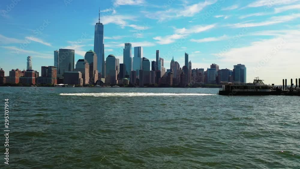 Aerial of Hudson Bay, high view of Manhattan cityscape, skyscrapers and landmark buildings, New York City at daytime, ships crossing cannel Aerial of Hudson Bay, high view of Manhattan cityscape, skyscrapers and landmark buildings, New York City at daytime, ships crossing cannel
