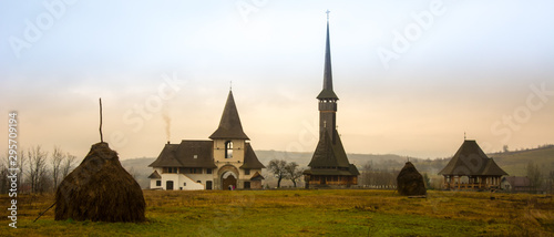 Old Village Medieval Romania Maramures Ieud Church Winter Snow Clouds photo