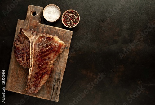 Obraz na płótnie Grilled T-bone steak on a stone table