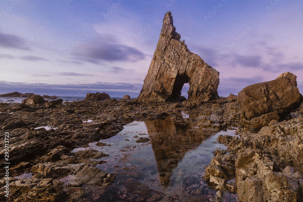 Beautiful rock formation in Asturias, Spain, Europe during low tide at sunset. Atlantic Ocean coastline