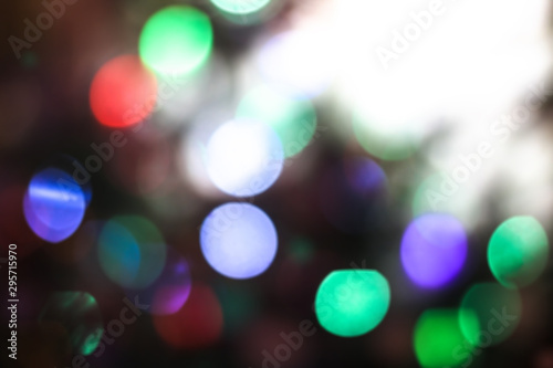 Beautiful Christmas background with garlands and bokeh. New year multi-colored picture. Abstract photo image for design