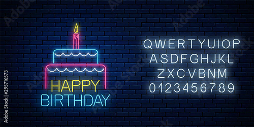 Happy birthday glowing neon sign with cake and a candle with alphabet. Birthday cake celebration symbol in neon style.