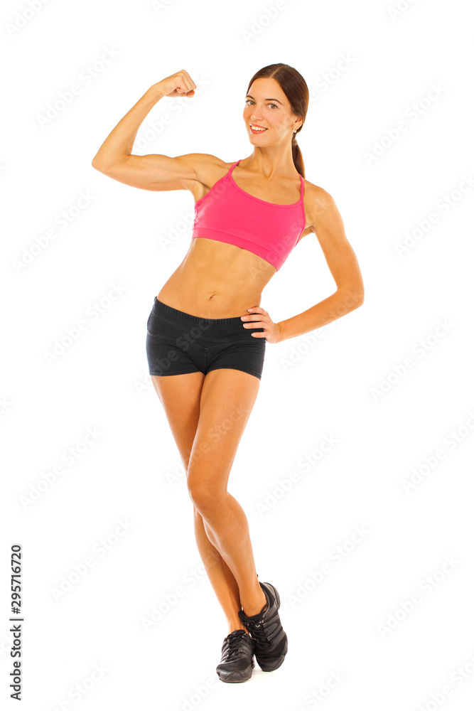 Young fitness brunette woman in red top and black shorts Young fitness brunette woman in red top and black shorts