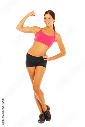 Young fitness brunette woman in red top and black shorts © Andrey_Arkusha
