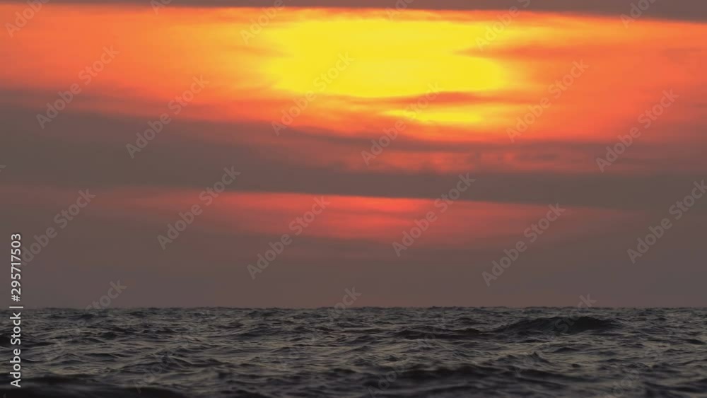 Amazing Colorful Sunset over Ocean waves rolling Amazing Colorful Sunset over Ocean waves rolling