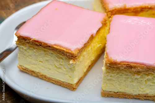 Tompoes or tompouce  iconic pastry in Netherlands and Belgium made from puff dough  icing  cream