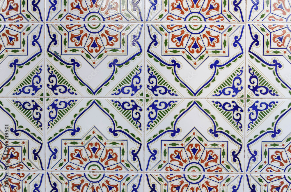 Old traditional Tunisian tiles.  Handmade Tunisian tiles with floral patterns. Islamic mosaic art pattern. Background of vintage ceramic tiles