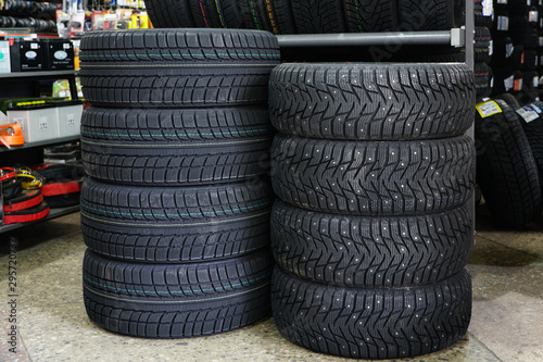 new winter tire sets with studs and without studs at tire shop photo