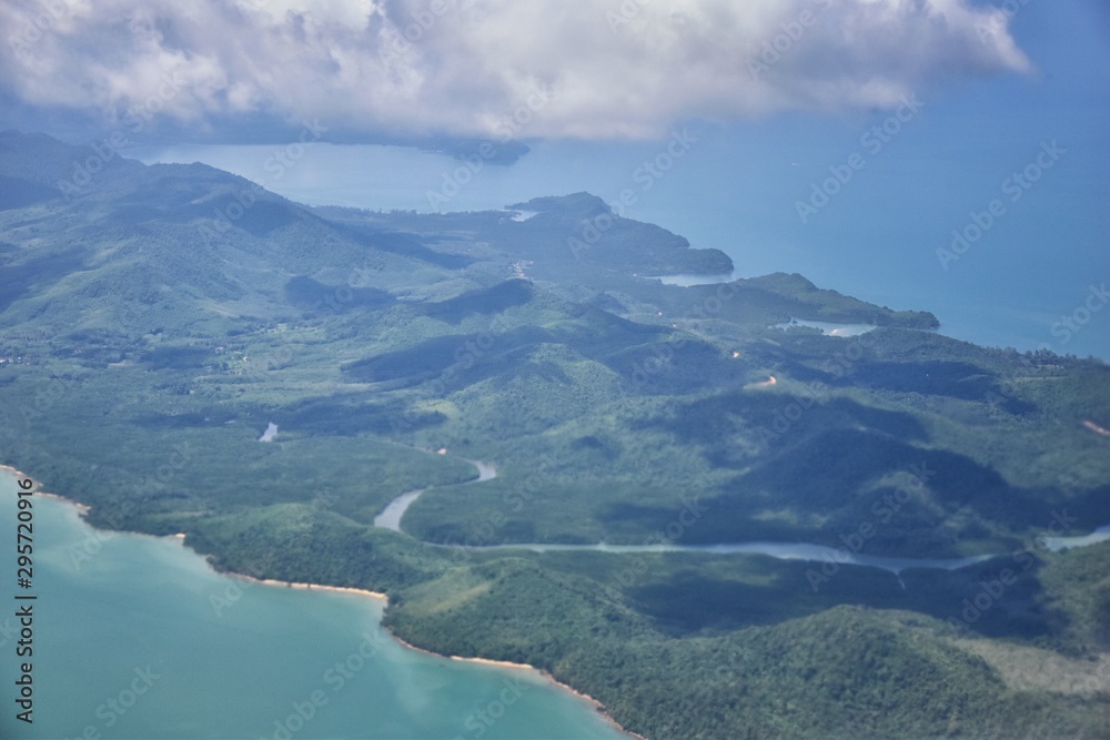 Phuket Thailand aerial drone bird's eye view photo of tropical sea, Indian Ocean, coast with Beautiful island south of Bangkok in the Andaman Sea, near the Strait of Malacca. Asia. Phuket Thailand aerial drone bird's eye view photo of tropical sea, Indian Ocean, coast with Beautiful island south of Bangkok in the Andaman Sea, near the Strait of Malacca. Asia.