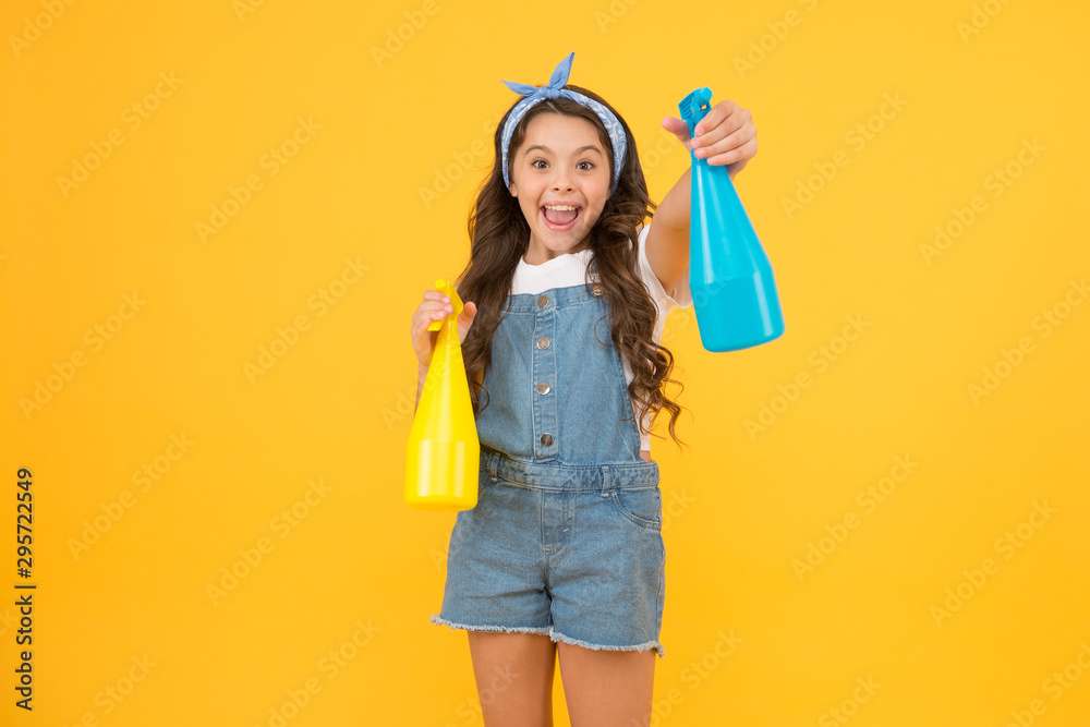 My reputation is spotless. Happy little girl hold household cleaning products. Small child smiling with household spray bottles. Enjoying household activities. Providing household help, copy space My reputation is spotless. Happy little girl hold household cleaning products. Small child smiling with household spray bottles. Enjoying household activities. Providing household help, copy space