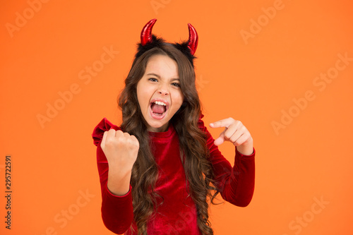 Energy and power. Halloween costumes designed after supernatural figures. Little girl red horns celebrate Halloween. Carnival concept. Child with imp style accessory Halloween party. Trick or treat