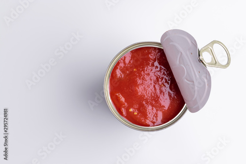 Tin of chopped canned tomatoes, isolated on white background, soft light