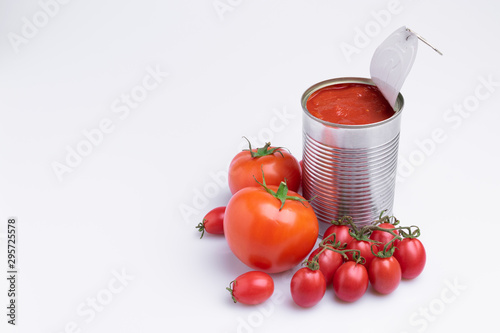 in of chopped canned tomatoes with whole fresh tomatoes, isolated on white background, soft light