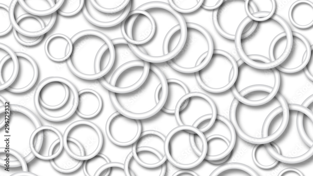 Abstract illustration of randomly arranged gray rings with soft shadows on white background