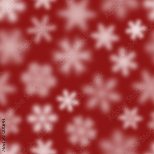 Christmas seamless pattern of white defocused snowflakes on red background