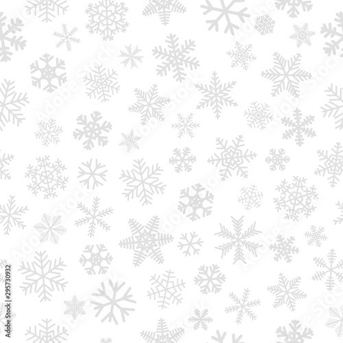 Christmas seamless pattern of snowflakes, gray on white background